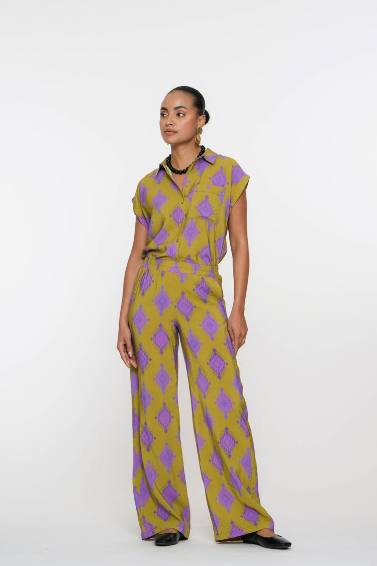 Geisha Fashion shirt, buttoned with geometric patterns, against white.
