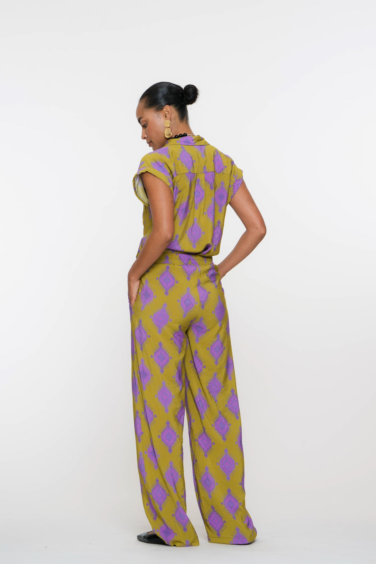 Geisha Fashion shirt, buttoned with geometric patterns, against white.
