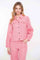 Geisha Fashion: Woman modeling pink jacket and pants, plain background.