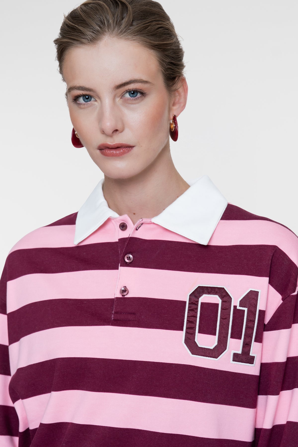 Geisha polo met strepen en sportieve details