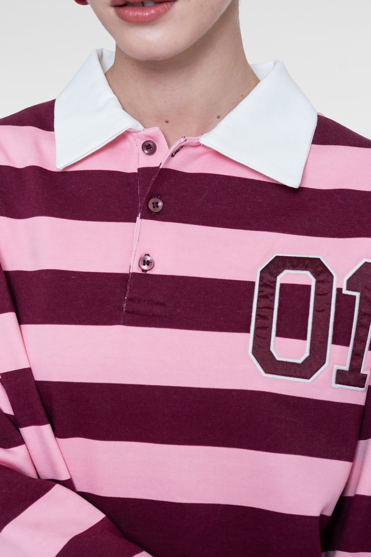 Geisha polo met strepen en sportieve details