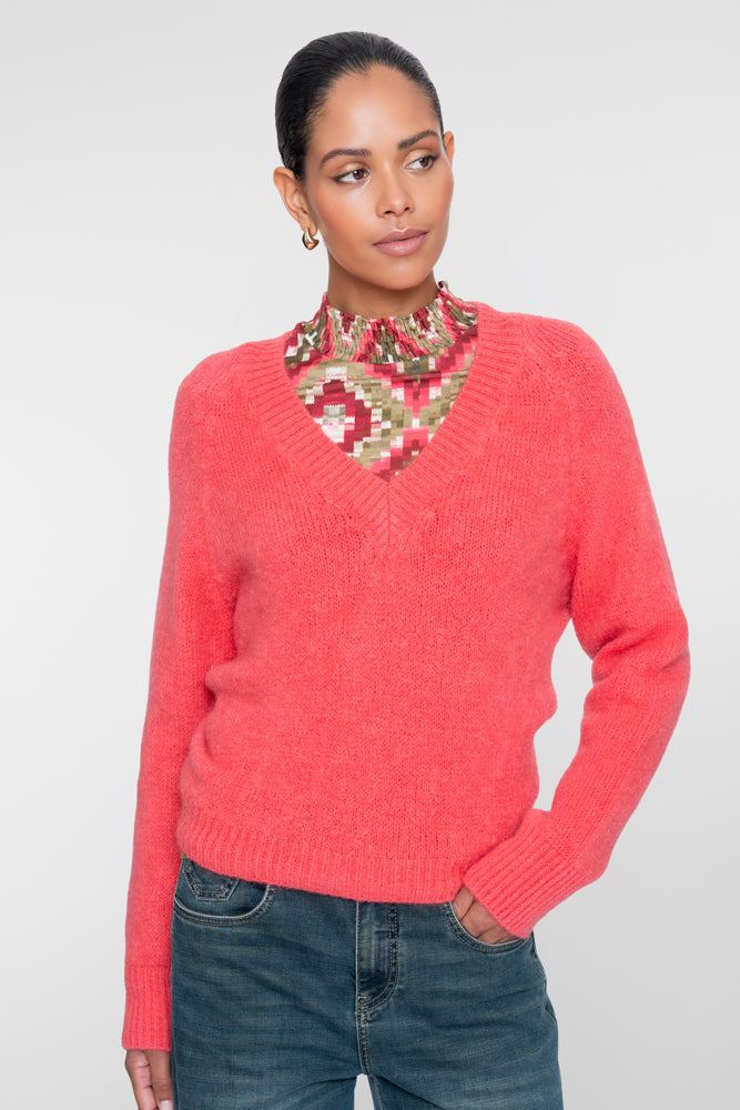 Geisha top met grafische ruitprint en gesmokte details.